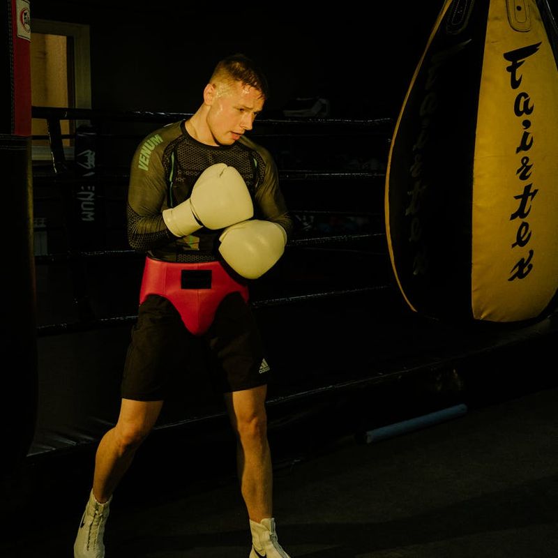 Man in a focused stance preparing for a strength movement.